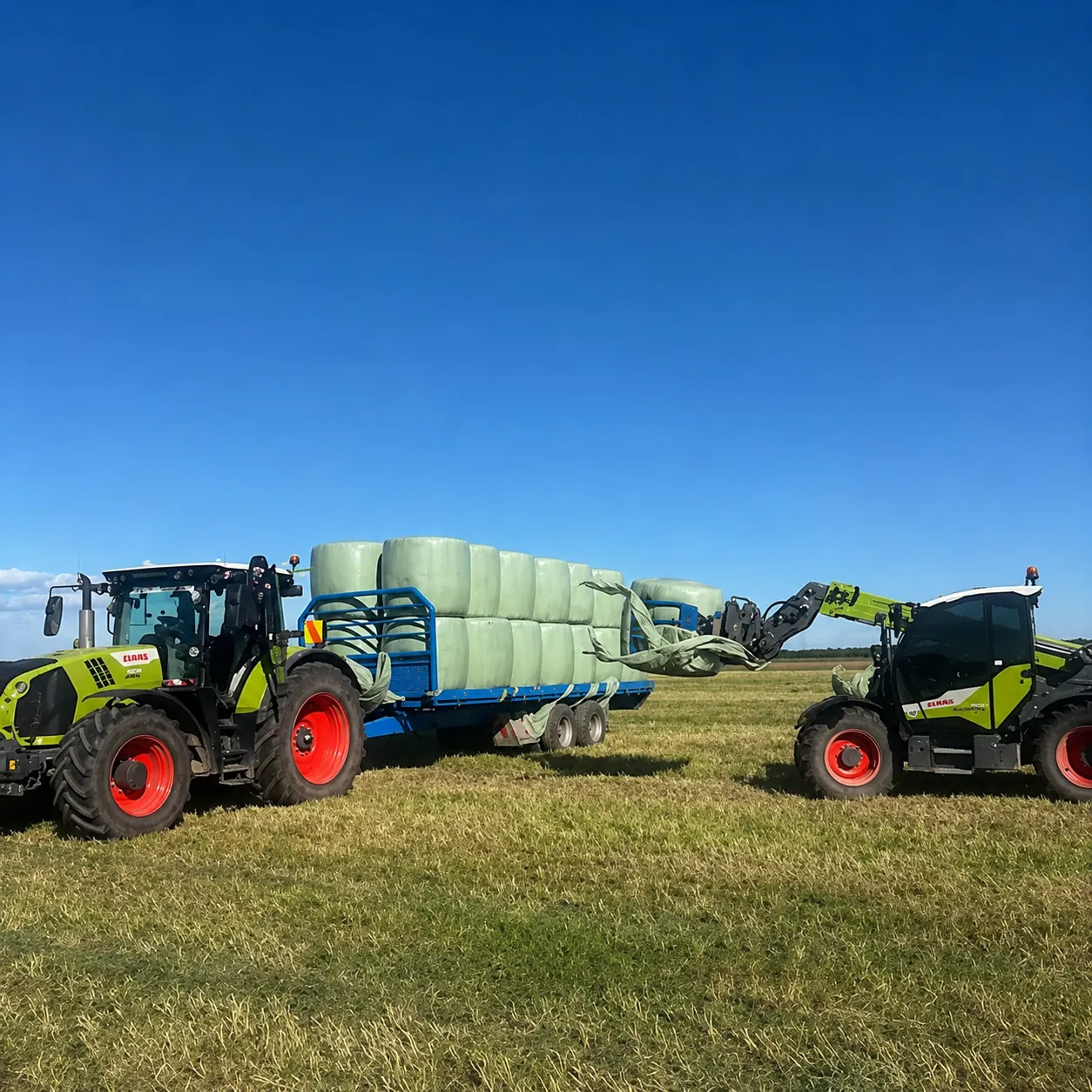 Claas tractor and loader stacking wrapped grass baleage in a Mid Canterbury paddock